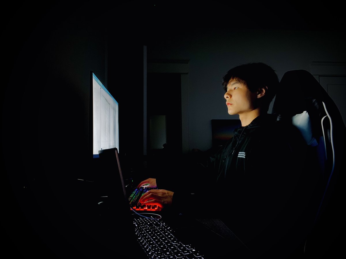Merrick working at a computer